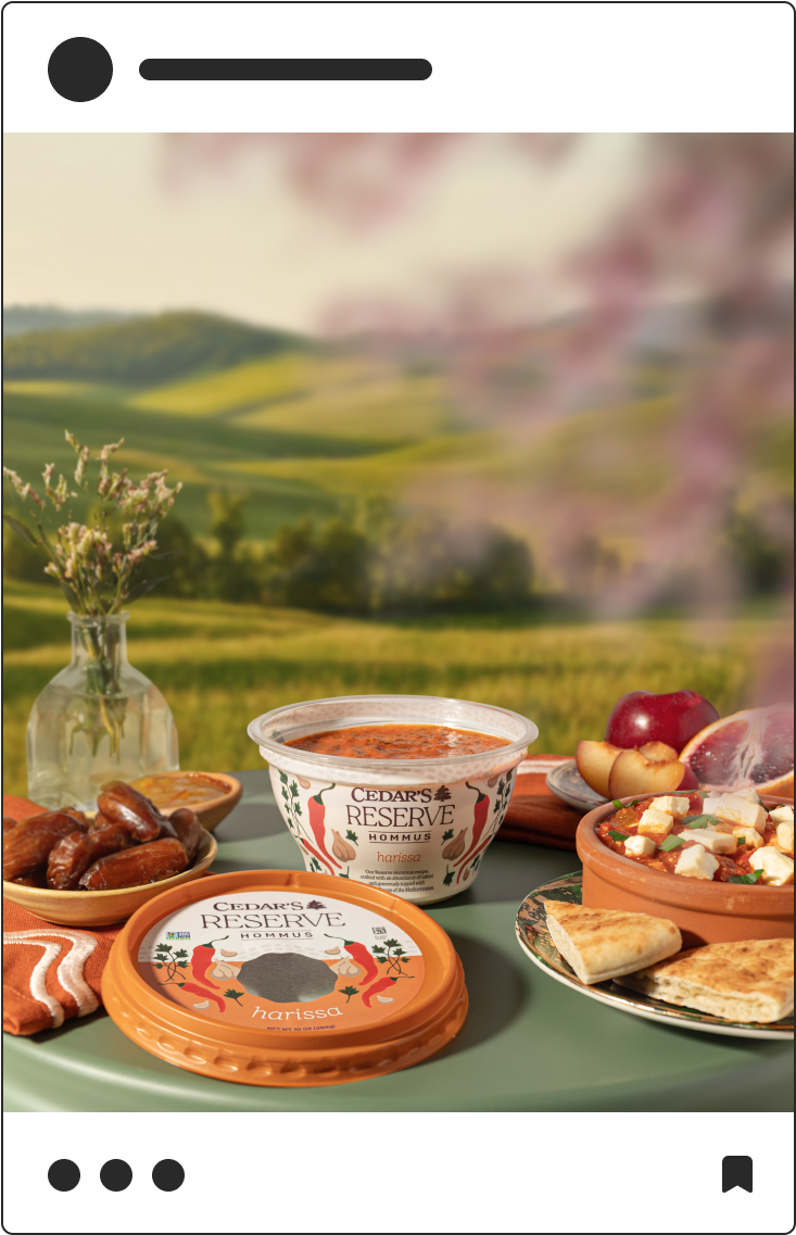 Social media post photograph of Cedar's Reserve Hommus in front of rolling hills