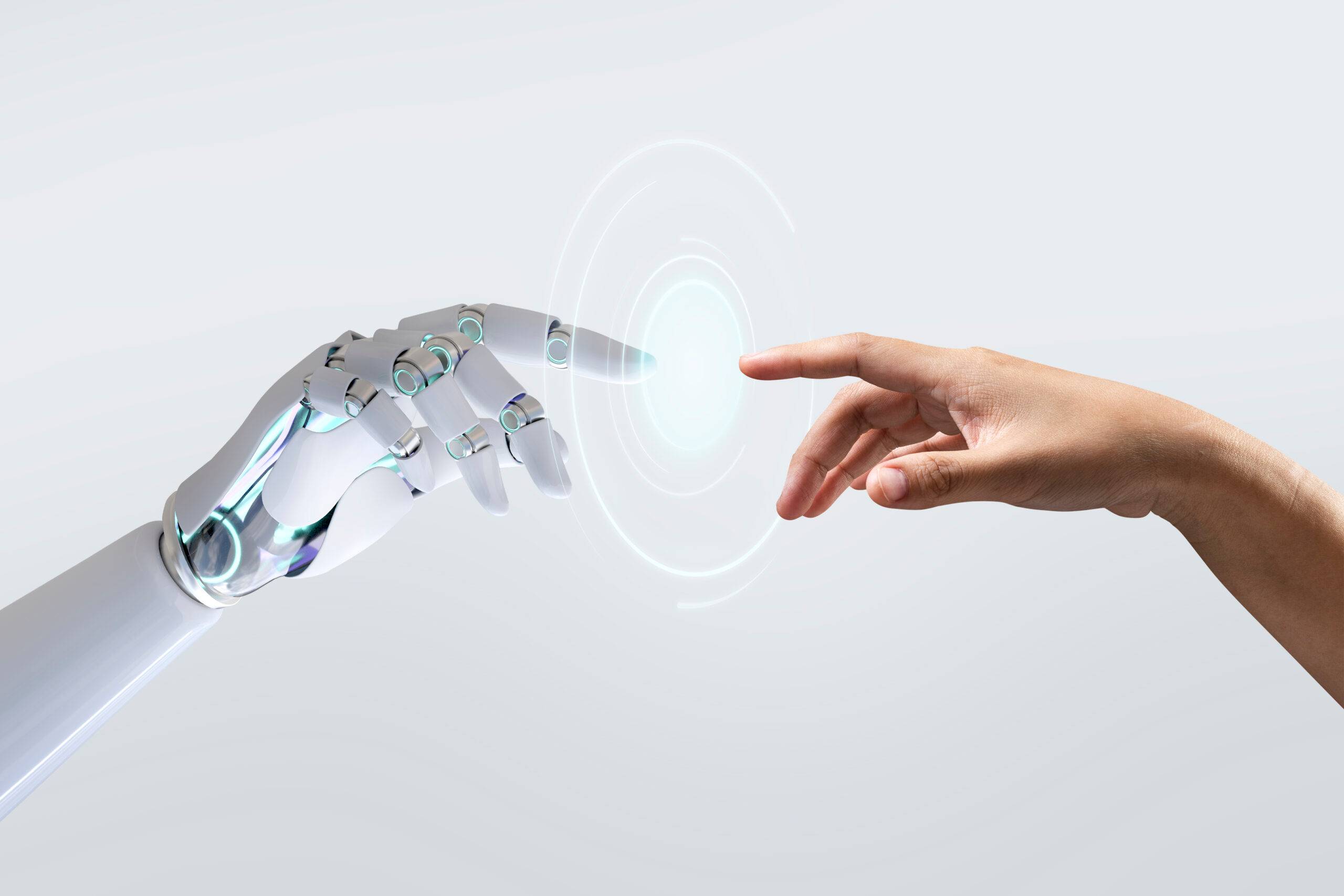 Robotic hand reaching out to touch a human hand with a futuristic disc of light in between